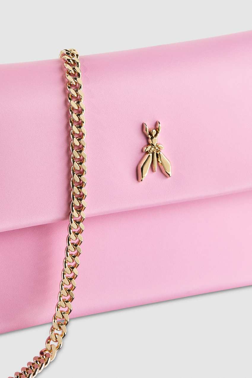 Clutch bag with strap outlet