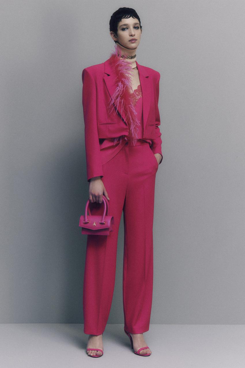 Pantaloni con pieghe in tessuto stretch